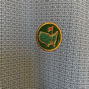 NWOT new masters polo. Perfect condition. Blue with pattern and patch XL